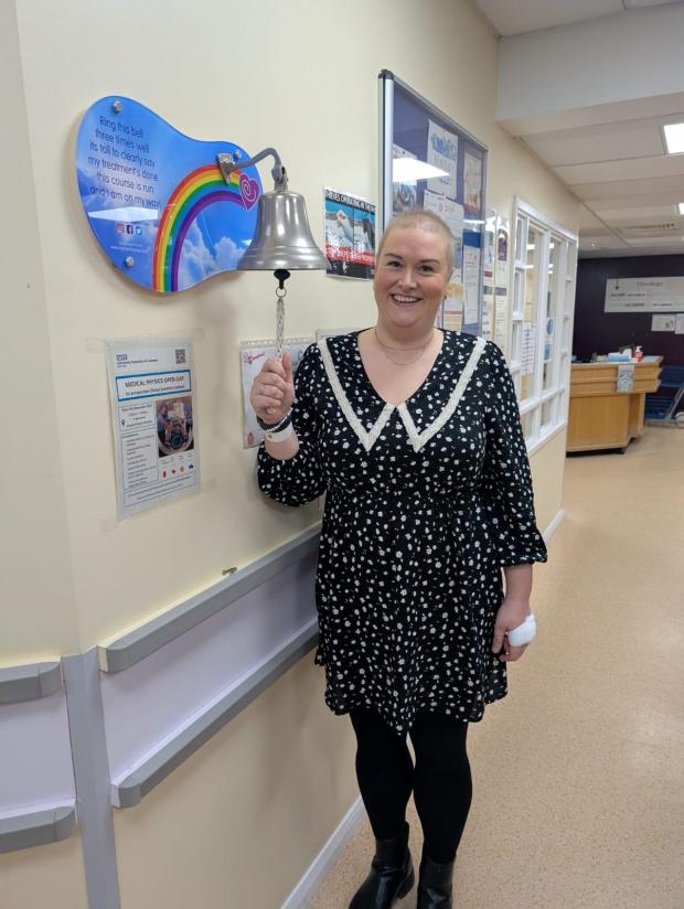 Rebecca ringing the bell on her chemotherapy ward after completing treatment