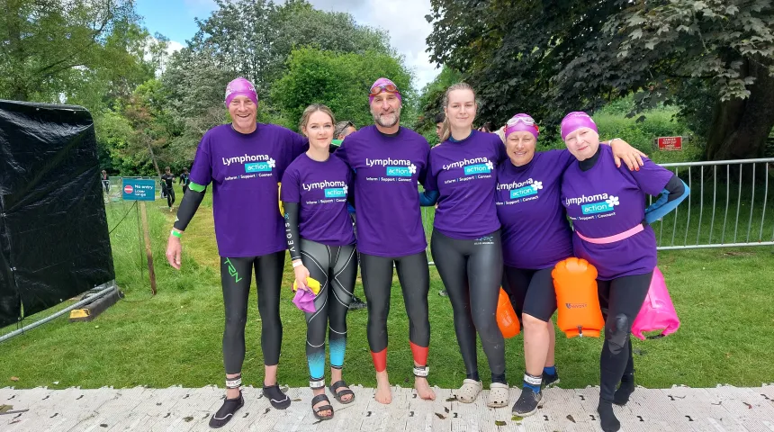 6 swimmers, in Lymphoma Action tshirts and wetsuits 