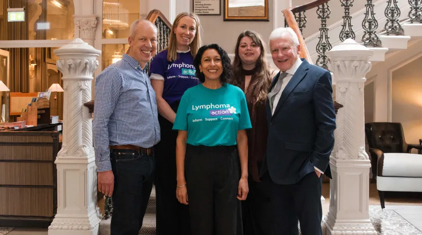 A group of volunteers smiling at the camera, with some wearing Lymphoma Action t-shirts.